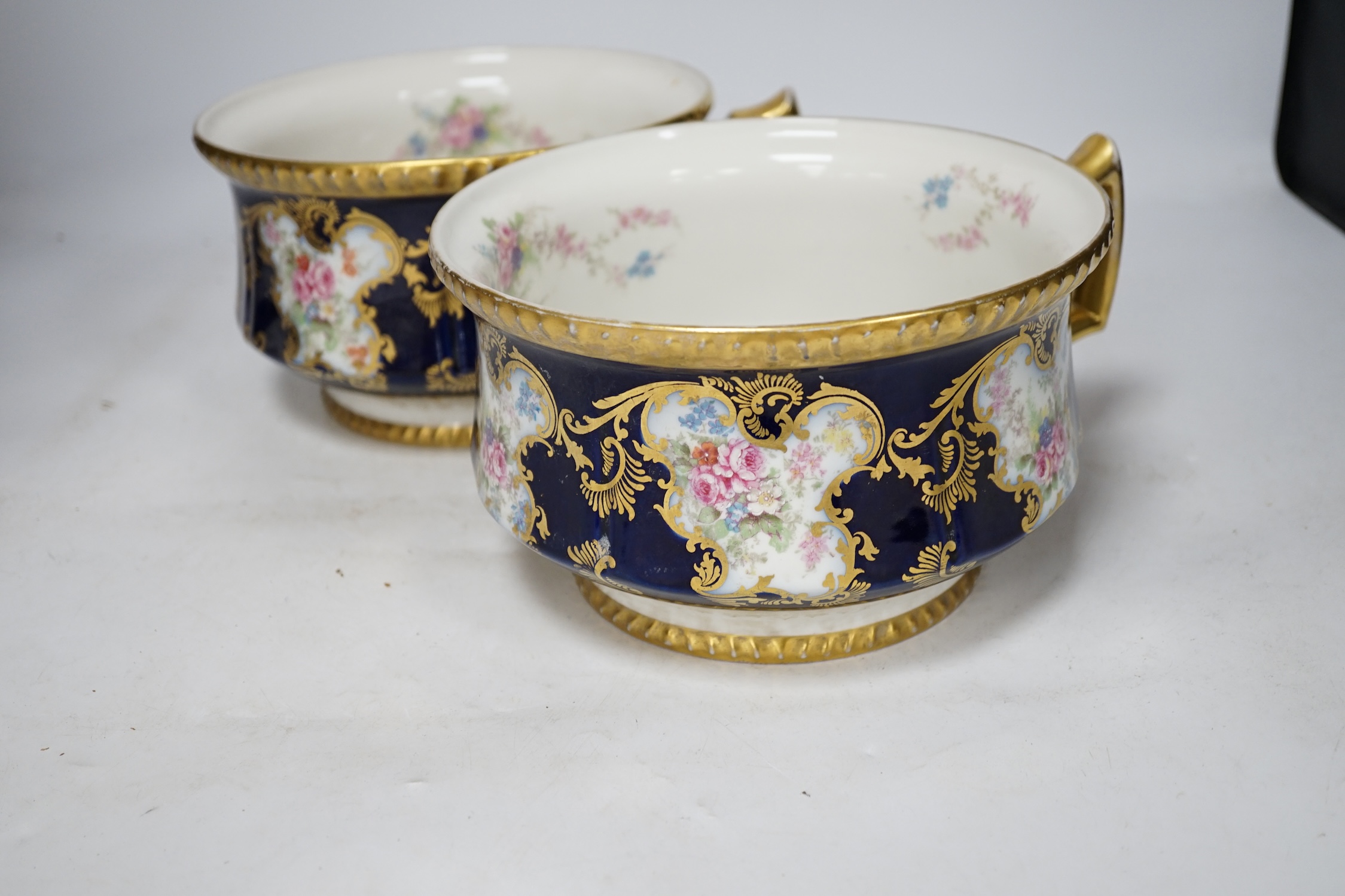 D. & C. Limoges, France, a pair of late 19th / early 20th century chamber pots, 21cm diameter. Condition - fair, some wear